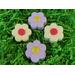 Handmade daisy shaped bath bombs. Individually wrapped. Four per package. Sunflower fragrance.